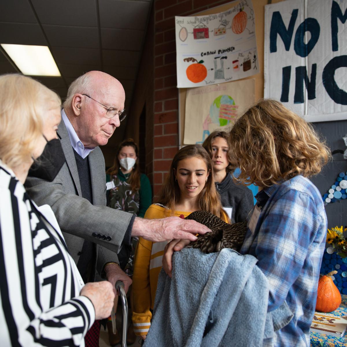 Senator Patrick Leahy and Marcelle Pomerleau talk with Crossett Brook Middle School students during the Farm to School Project Share. Senator Patrick Leahy and Marcelle Pomerleau talk with Crossett Brook Middle School students during the Farm to School Project Share.