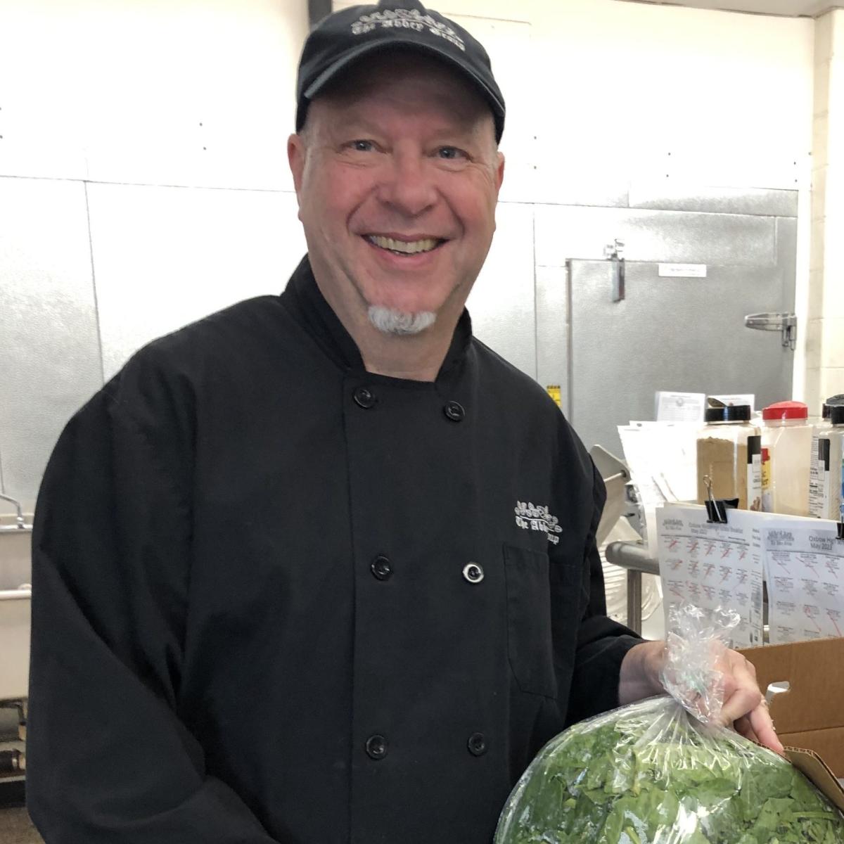 Food Service Director Bob Hildebrand holds local spinach (a Harvest of the Month product) grown at Joe’s Brook Farm and sourced through Green Mountain Farm Direct. Food Service Director Bob Hildebrand holds local spinach (a Harvest of the Month product) grown at Joe’s Brook Farm and sourced through Green Mountain Farm Direct.