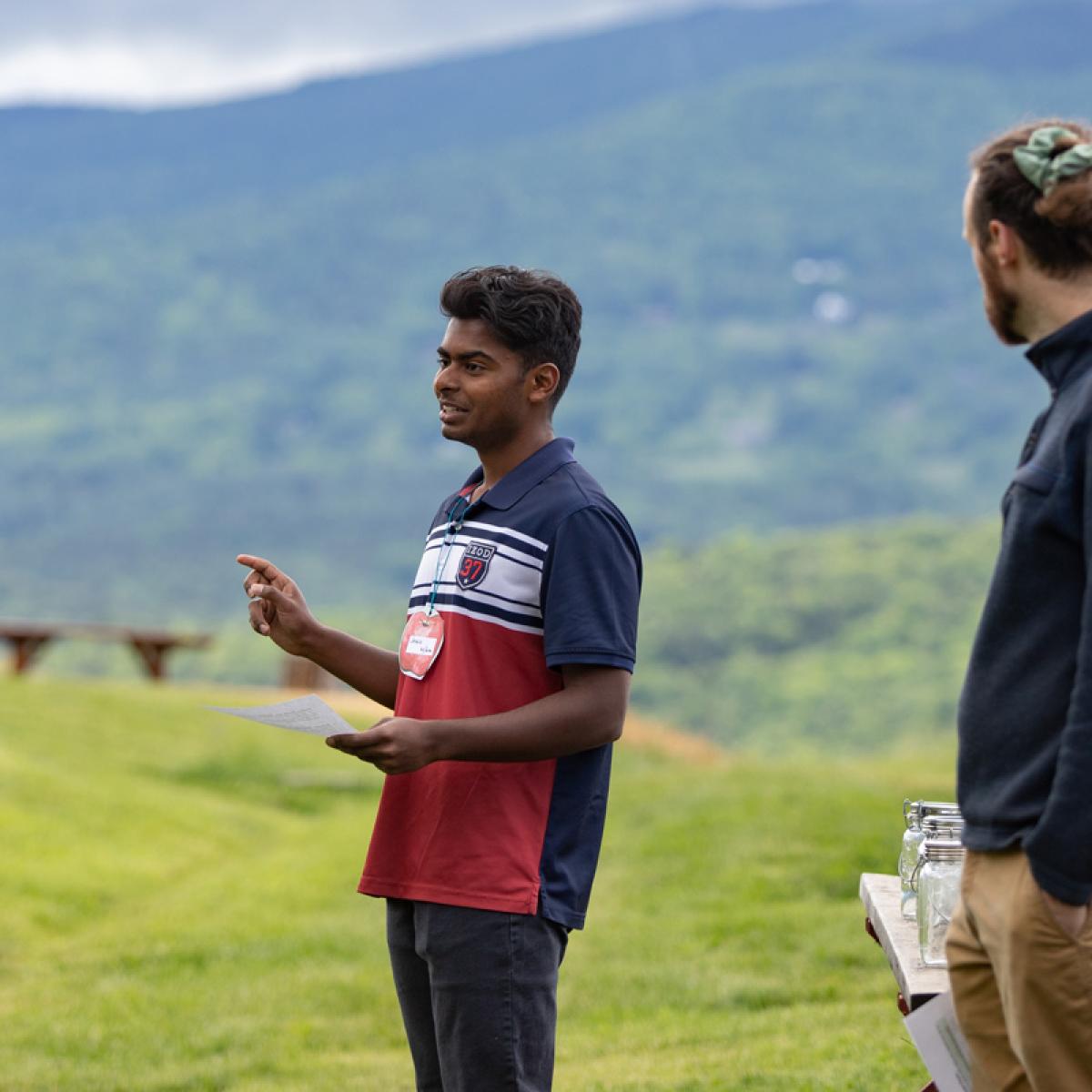 A student speaks outdoors