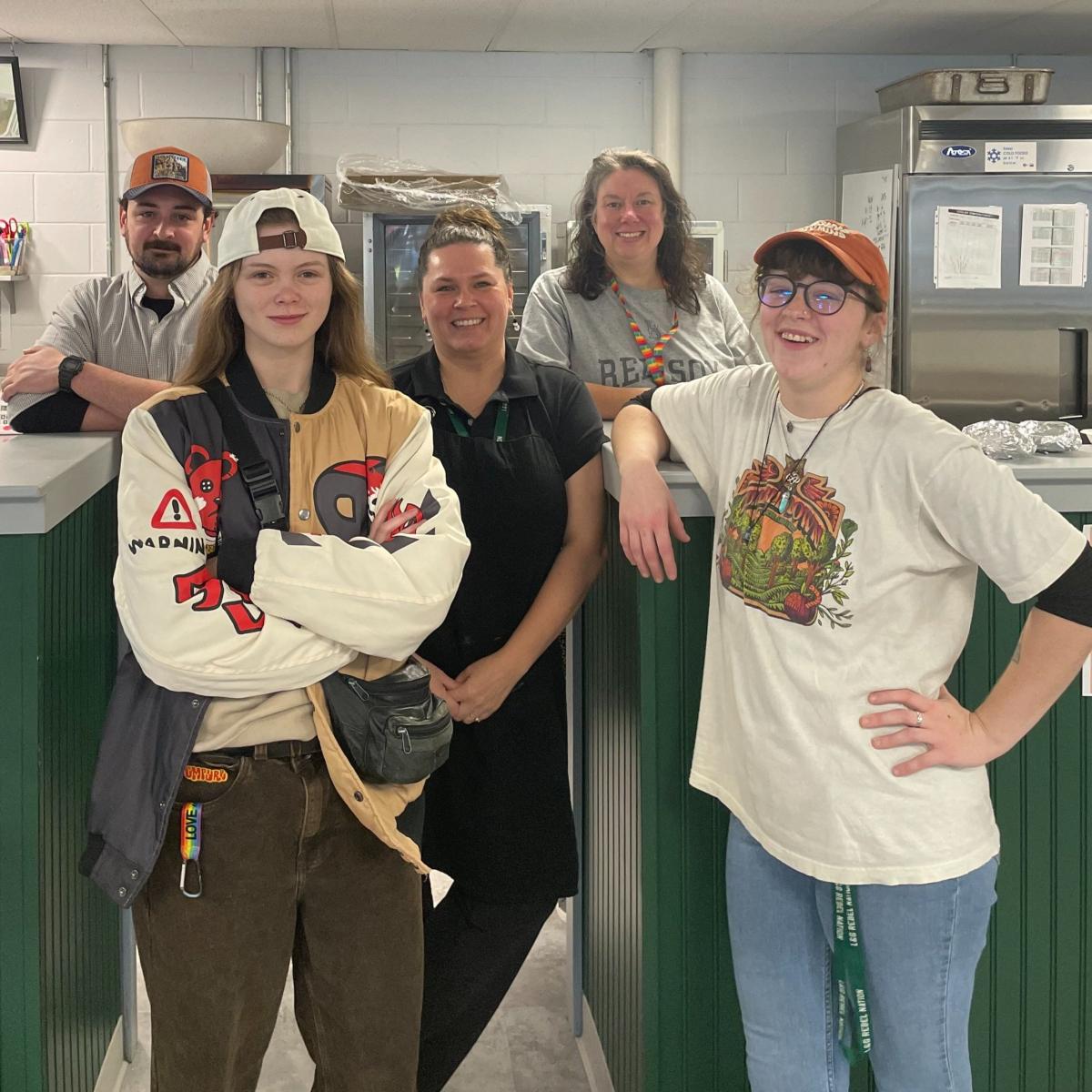 High school students and school nutrition staff in the kitchen