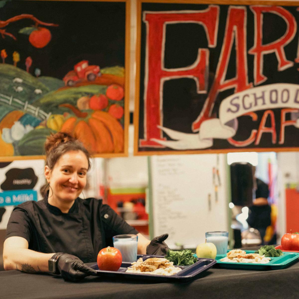 A chef showcases healthy school food on lunch trays A chef showcases healthy school food on lunch trays
